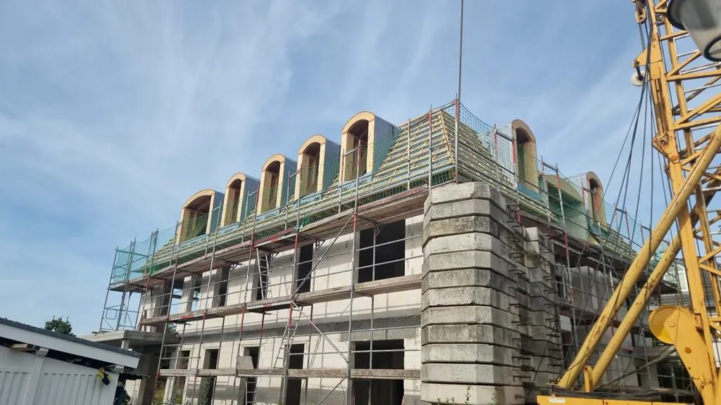 Arched dormers on a new building during construction