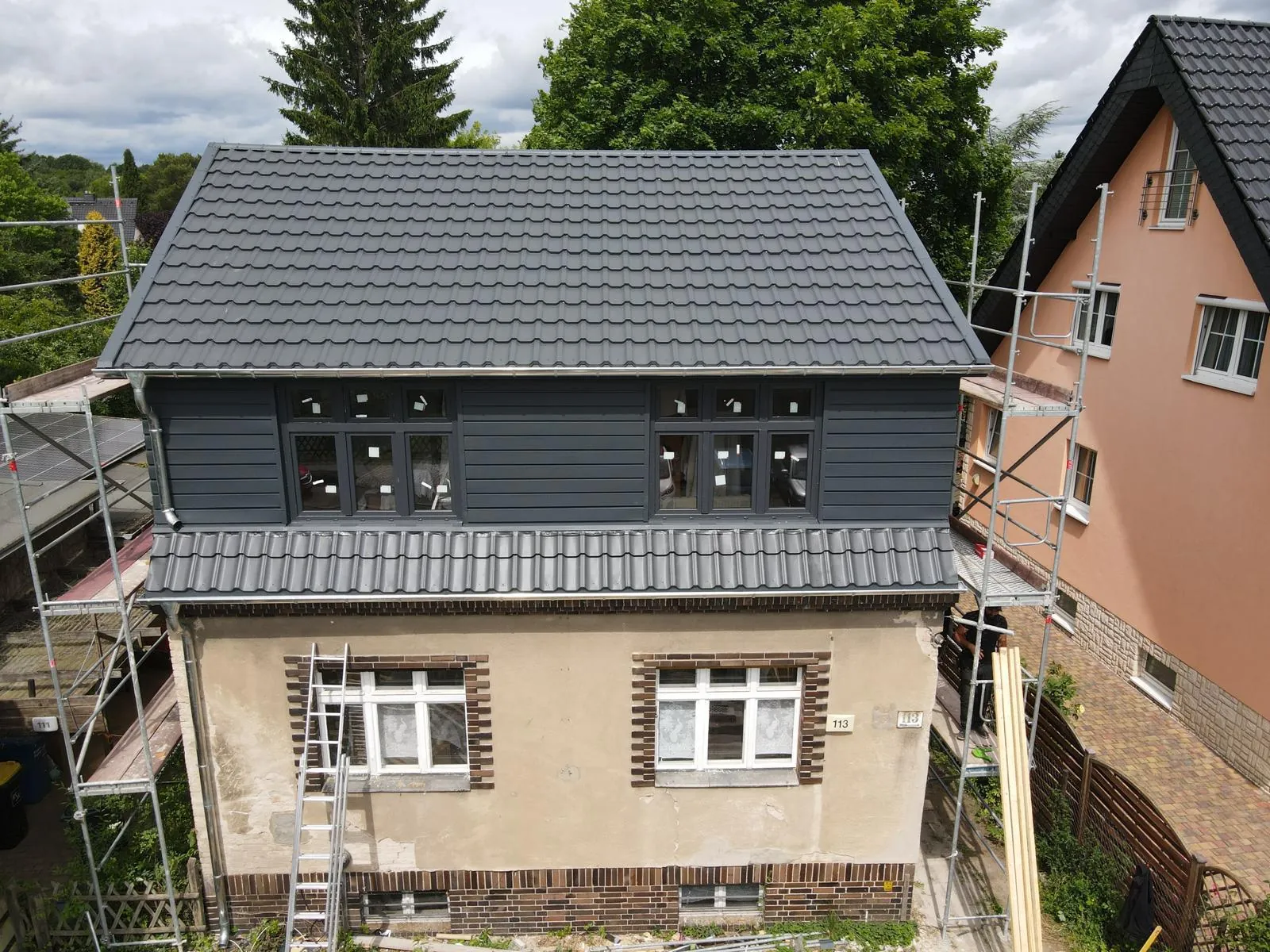 House with a new anthracite tile-effect metal roof