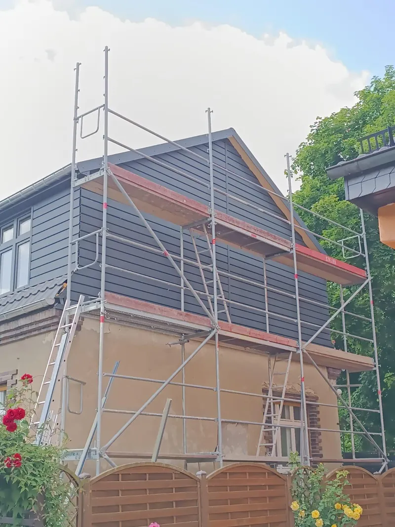 Facade work on a house with scaffolding