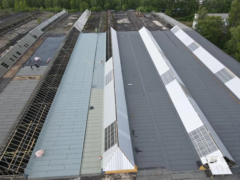 Refurbishing a large industrial flat roof with skylights
