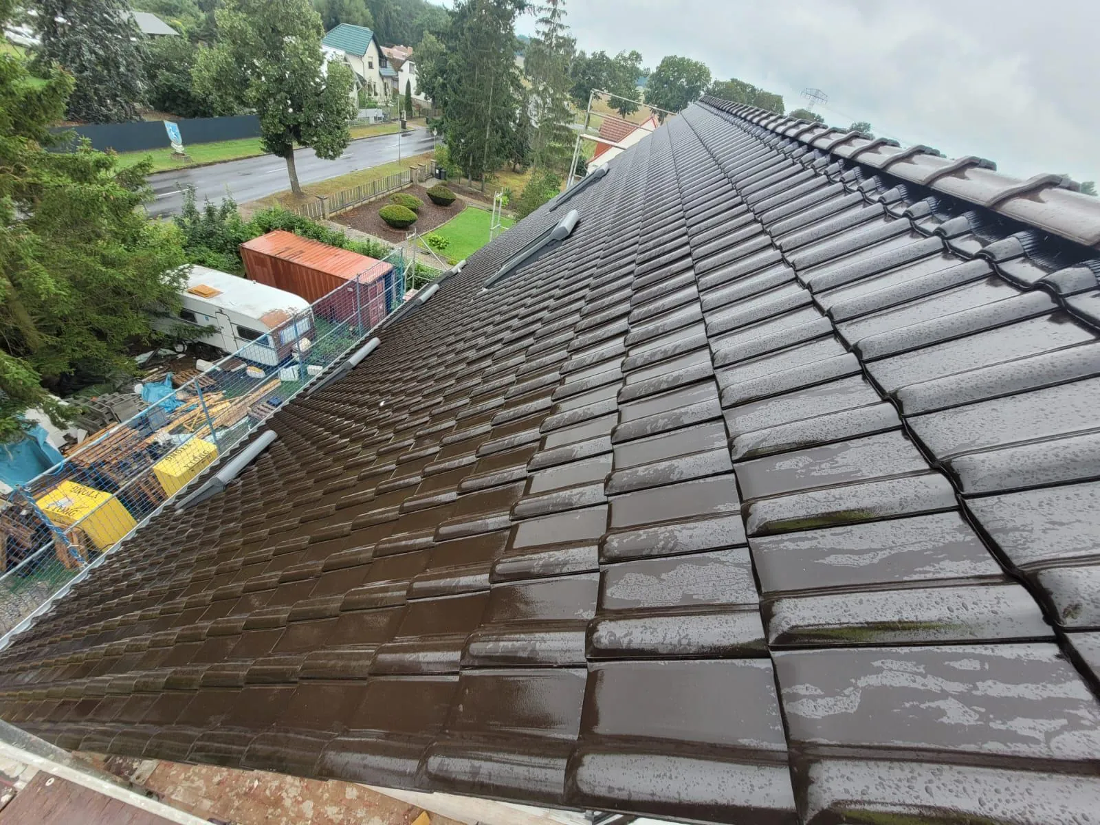 Pitched roof with glazed tiles during installation