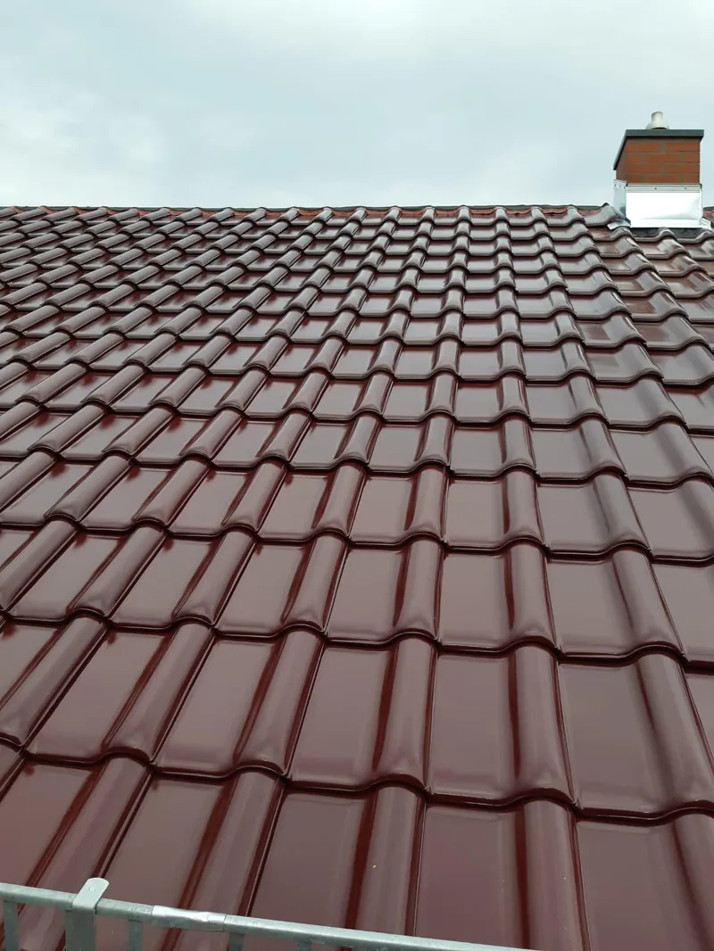 Red-brown roof tiles after re-roofing