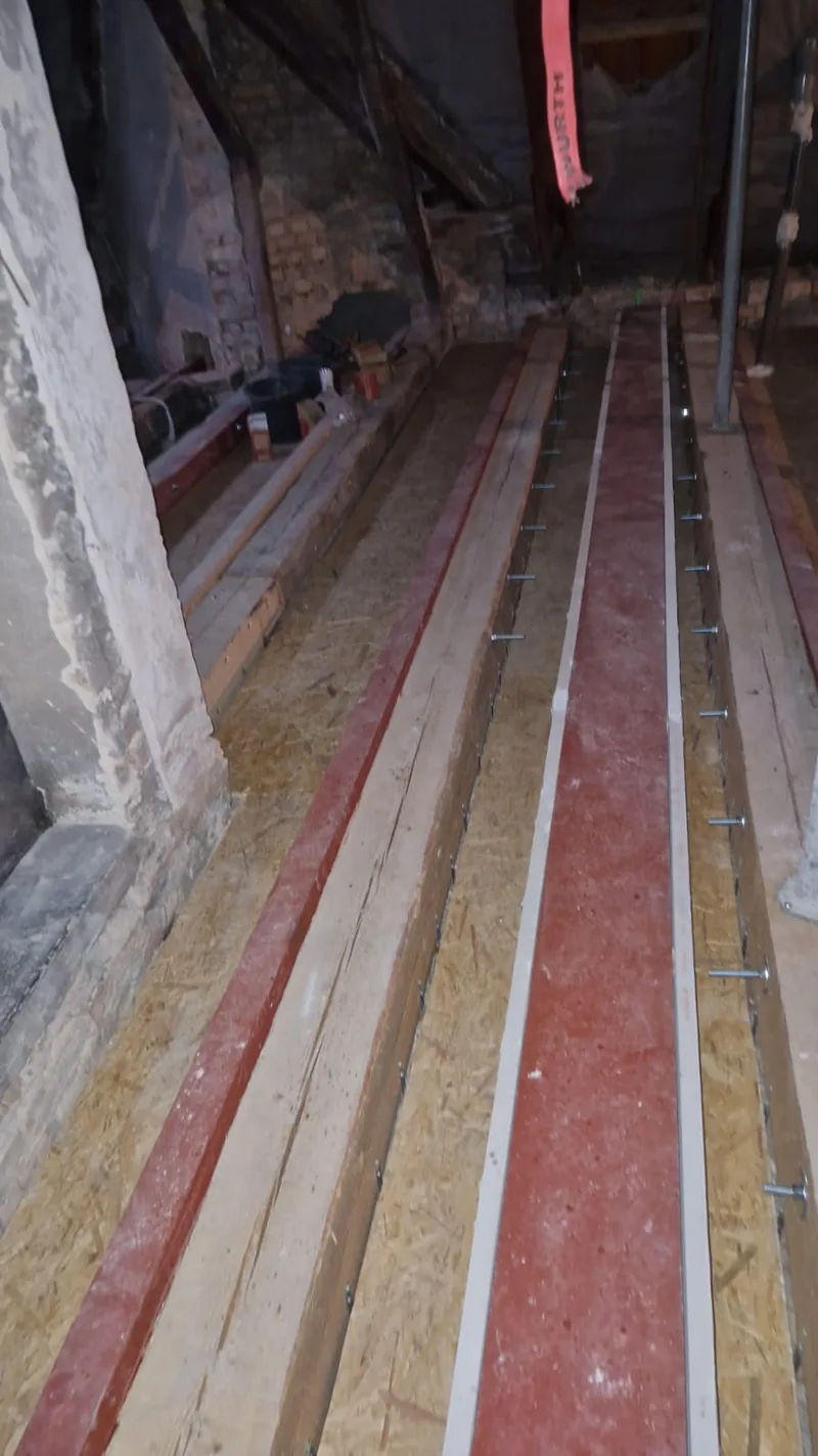 Floor joists in the attic after reinforcement
