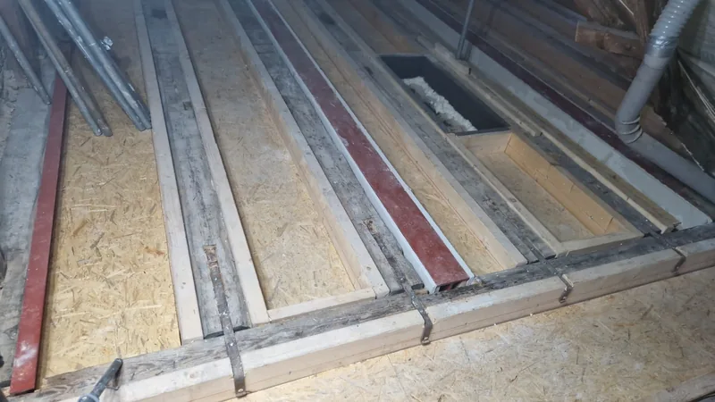 Reinforced floor joists with new boarding in a period building