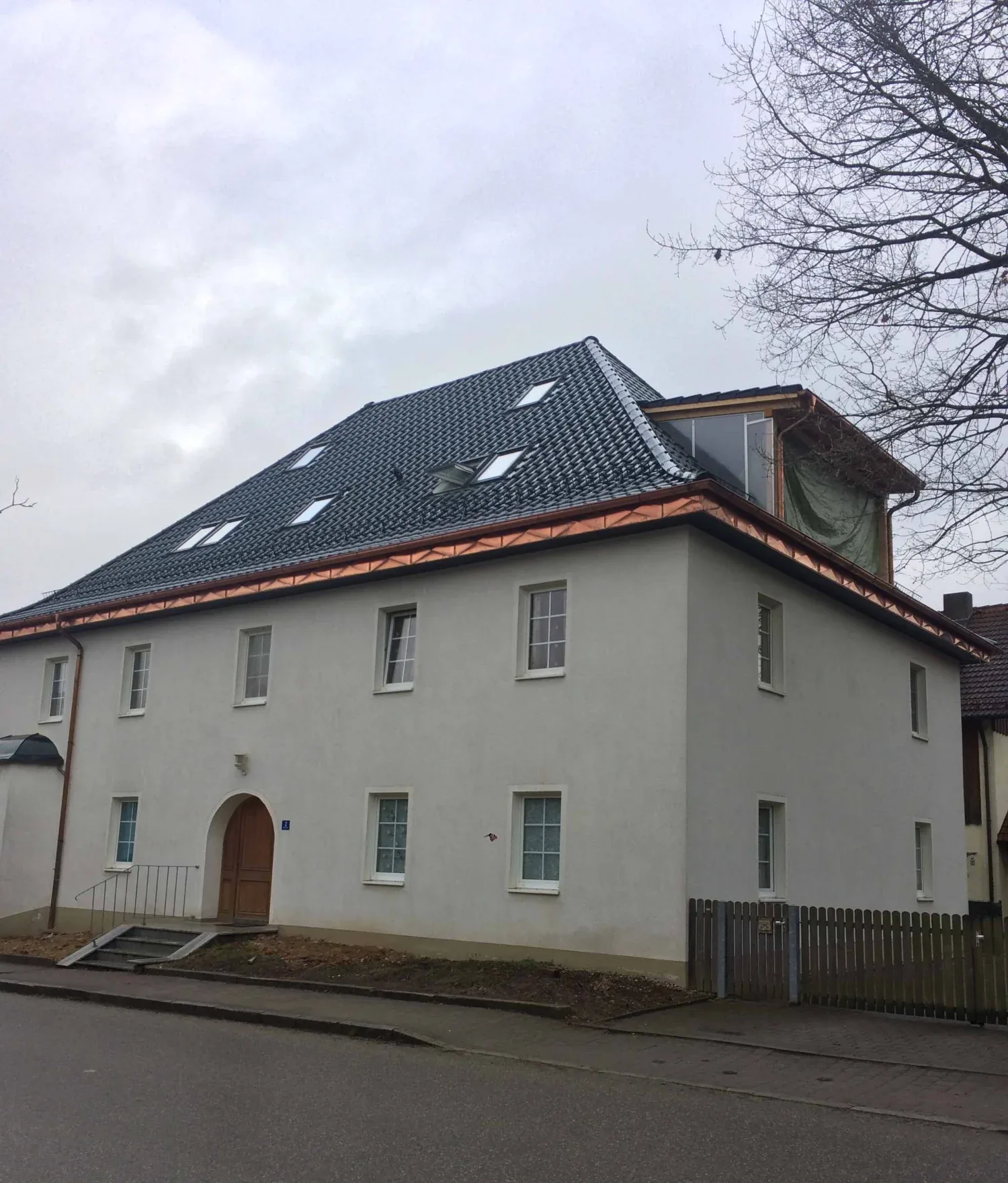 After: renovated façade and new roof
